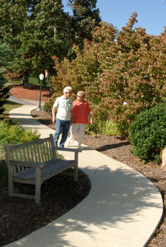 A smiling couple at home at Fletcher Park Inn
